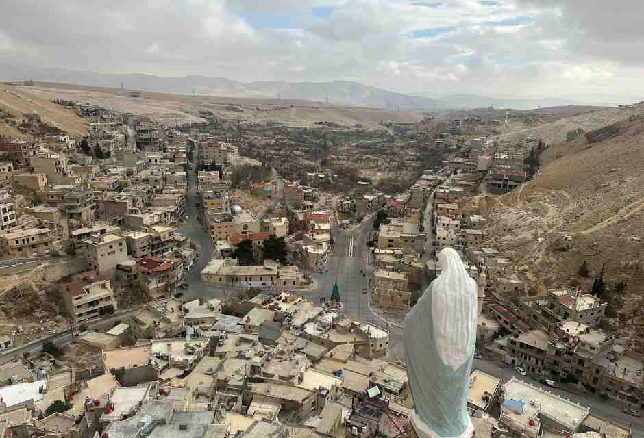 The statue of the Virgin Mary overlooking the ancient Christian town of Maaloula (photo by Luca Gambardella)