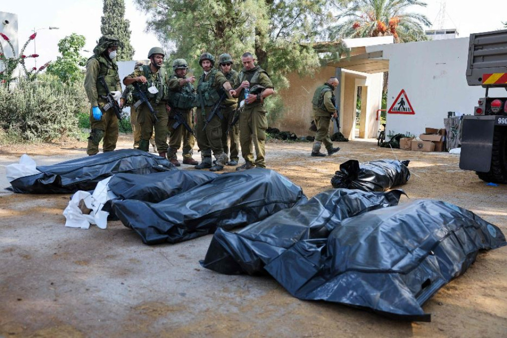 Altri cadaveri recuperati dal kibbutz di Kfar Aza - Ansa